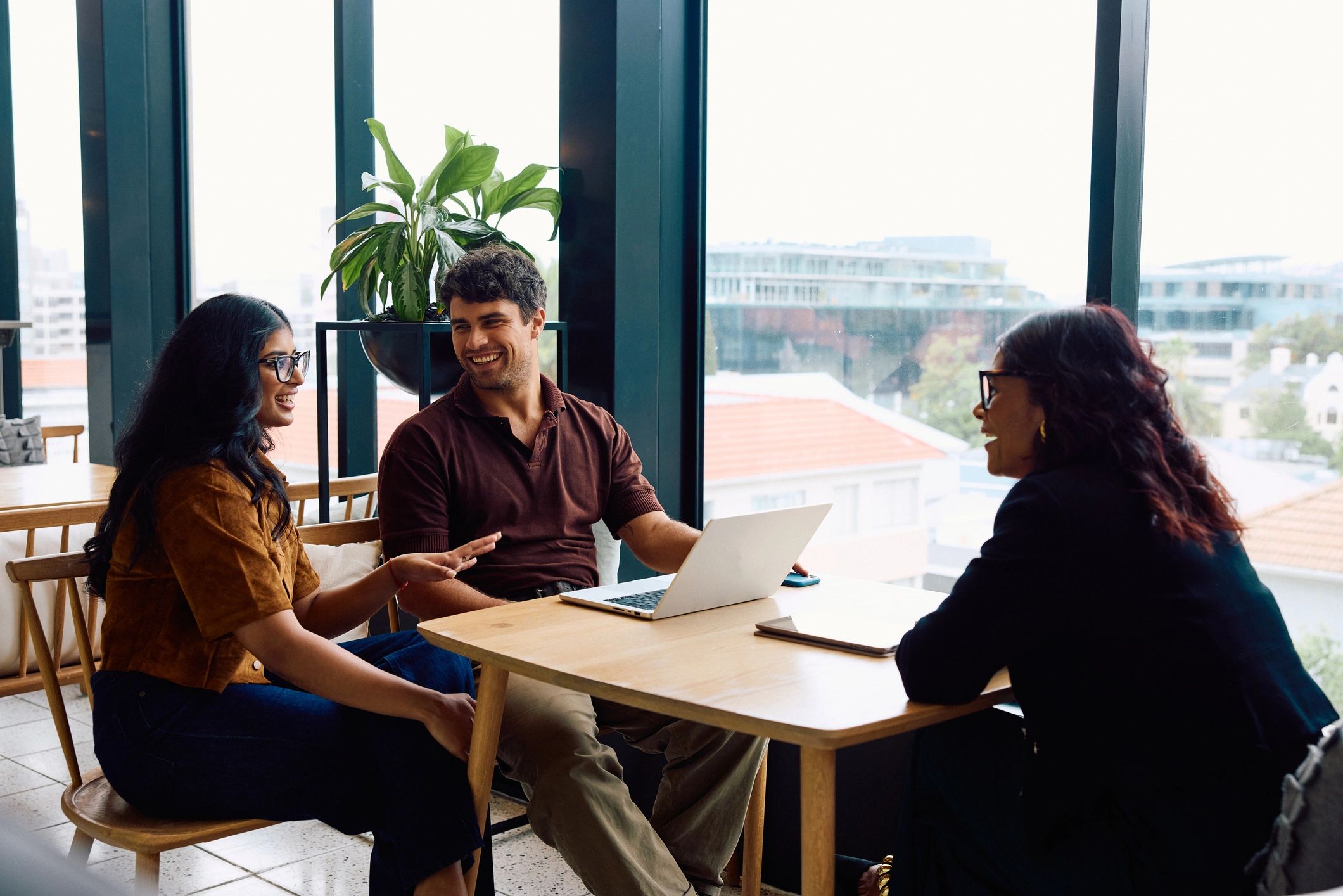 Business people discussing around a table in a coworking office